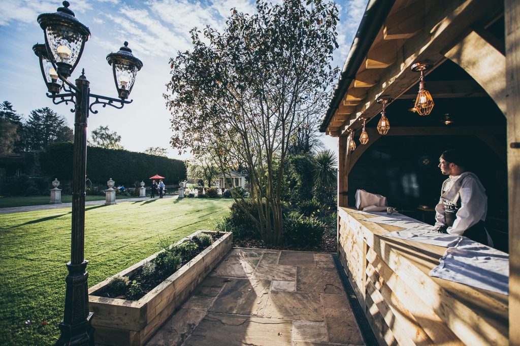 The Terrace Grill and Chef Max are photographed as the sun is setting over Rowton Castle's gardens