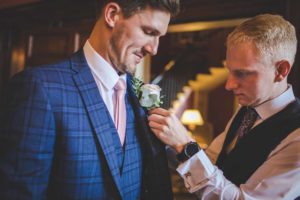 The Groom has help with his Buttonhole