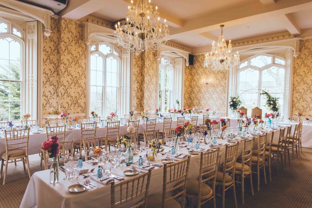 Here, the Cardeston Suite is home to Two Long Banqueting Tables that have been Dressed with Bud Vases filled with Bright Blooms