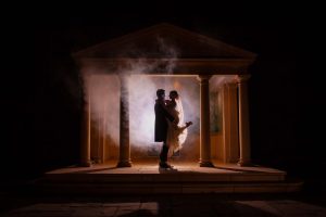 An atmosphere smokebomb picture taken in the Linden Belvedere. The Groom lifts the Bride and they post