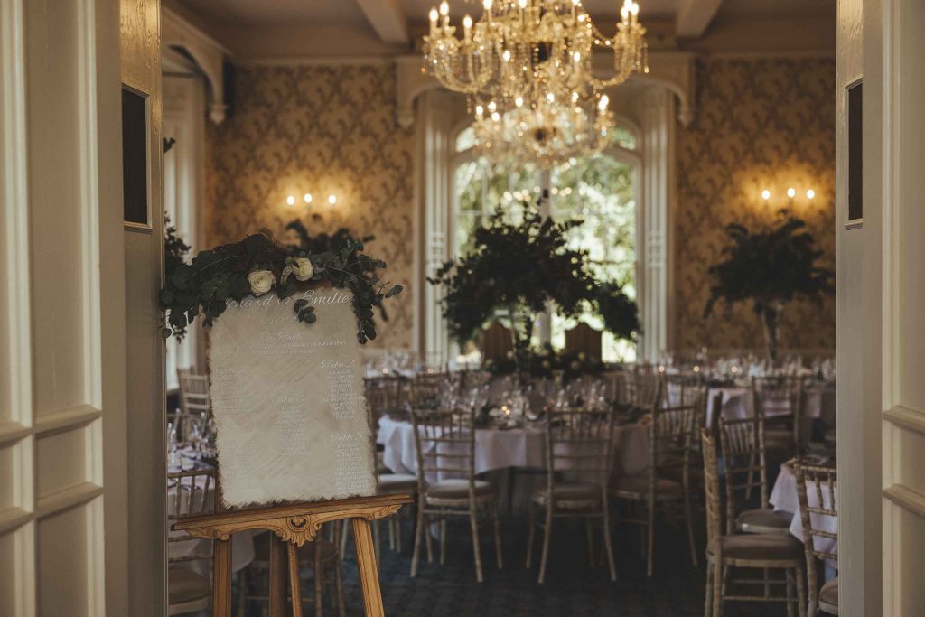 Taken from the doorway, the Cardeston Suite is photographed set with tables and chairs ready for the wedding breakfast