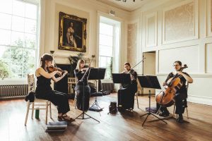 A string quartet perform in the beautiful Cardeston Suite