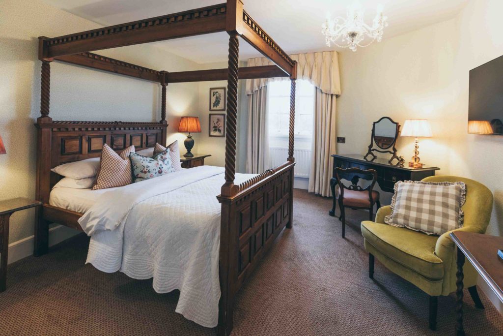 Rowton Castle's Classic Four Poster Bedroom is Soft and Botanical with White and Green Furnishings