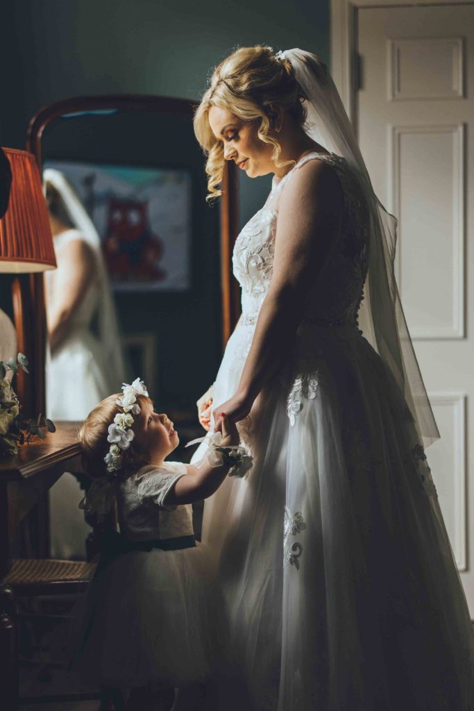 The Bride and Her Daughter Share a Loving Moment in the Orchard Suite