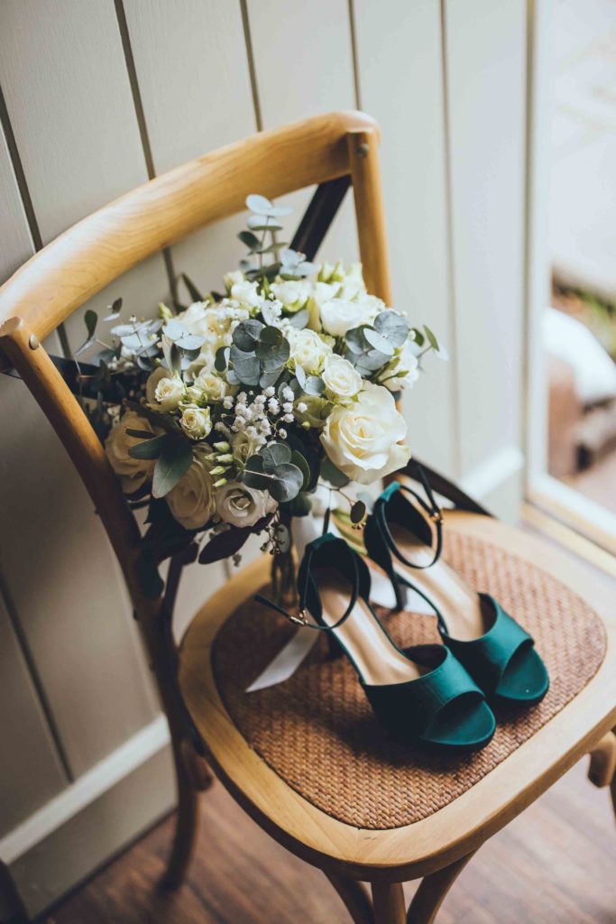 The Bridal Accessories; Emerald Bridal Shoes and Bouquet of White and Green Flowers