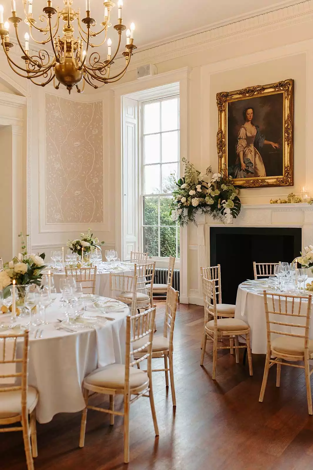 Light and airy, the Cardeston Suite is set for a private diner with fresh florals, white linens and chiavari chairs